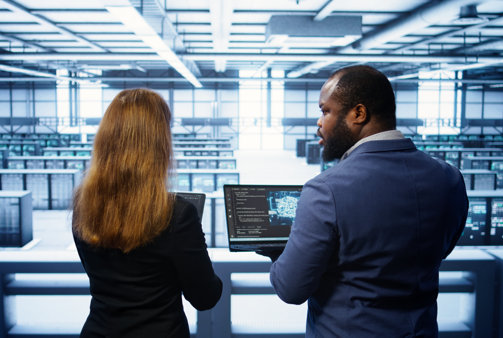 IT professionals overseeing server operations in a data center, representing Bamshaw's IT architecture and infrastructure consulting