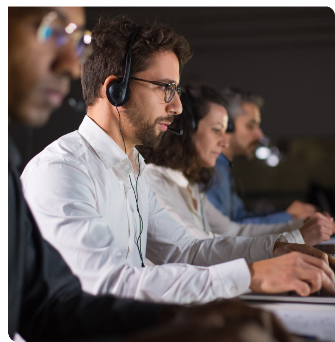 Support team in headsets at workstations, representing Bamshaw's support for federal agencies and prime contractors